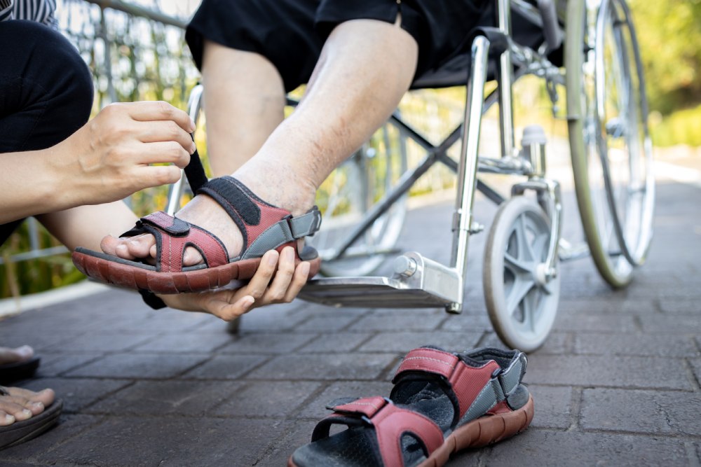 Close up of woman holding a shoes in her hand