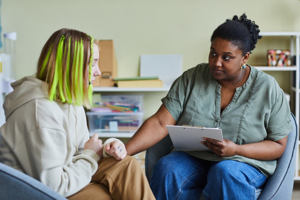 Woman talking to a sick lady